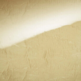Aged paper texture with a diagonal white band, featuring warm beige tones, creases, and a matte finish, creating a rustic composition.